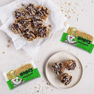 A plate with a Coconut Oat Bar, a wholesome snack made of whole grain oats, gluten-free, vegan, and dairy-free.
