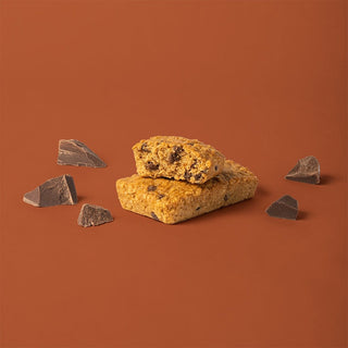 A close-up of a chocolate chip oat bar, showcasing wholesome oats and chocolate.