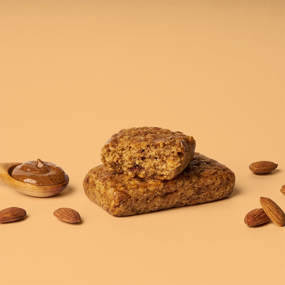 A close-up of an Almond Butter Oat Bar by Bobo’s Oat Bars, featuring whole grain oats, coconut oil, and almond butter.