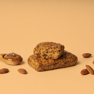 A close-up of an Almond Butter Oat Bar by Bobo’s Oat Bars, featuring whole grain oats, coconut oil, and almond butter.