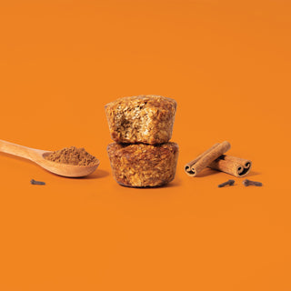 Oat bite on orange background with surrounding pumpkin