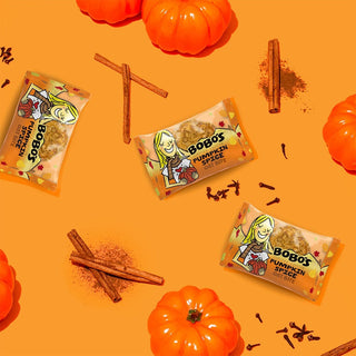 Oat bite on orange background with surrounding pumpkin