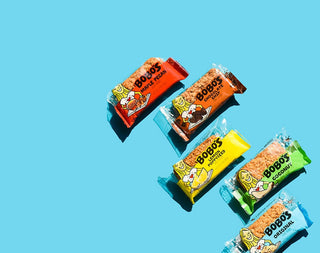 Multiple Bobo's oat bars laid out on blue background