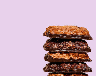 Dipped bars stacked on pink background