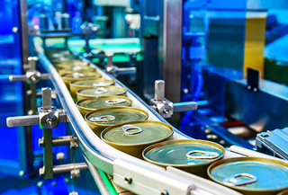 Cans being processed on conveyor belt