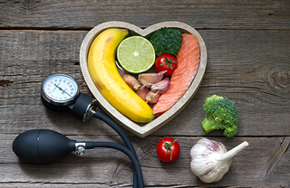 fruits and veggies in a heart shaped bowl