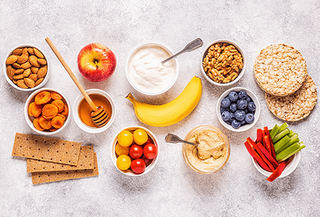 Various Healthy Snacks on a Grey Background