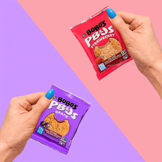 Two Bobo's PB&J Oat Snacks Variety Pack on purple and pink backgrounds